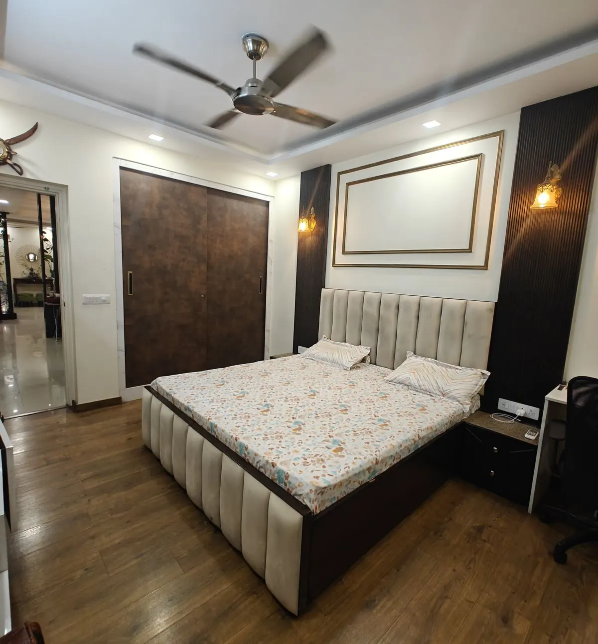 Bedroom with upholstered bed and full-height laminate wardrobe, Gurugram home by Nuvasah Interiors